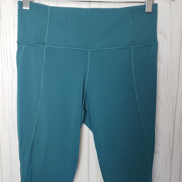 Athleta Size M‎ Lighting Capri Leggings Stash Pockets Mesh Reflective Strip Teal - Picture 3 of 12